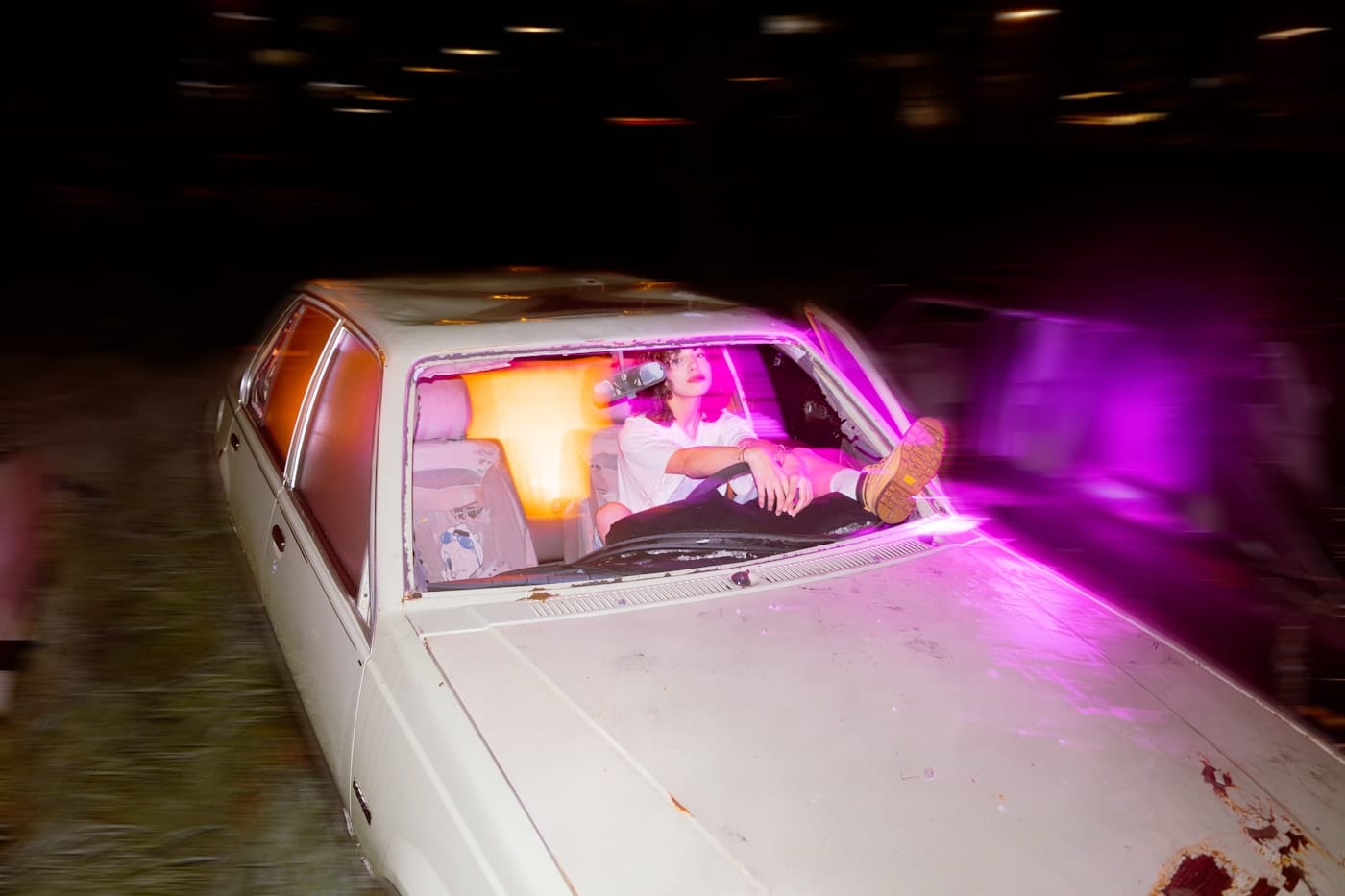 Woman rests in a car with her feet up