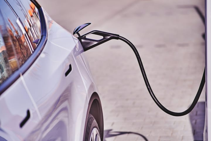 an electric car plugged into a charging station